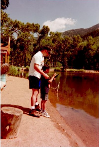 Shane showing Nathan how to hold the pole